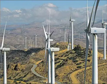  ?? Irfan Khan Los Angeles Times ?? BY 2045, California’s climate plan envisions a thirty-five-fold increase in zero-emission vehicles and four times the amount of power generation from wind and solar energy. Above, a wind farm in Kern County in 2021.