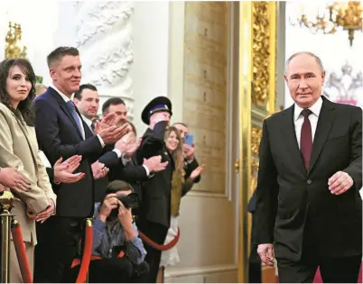  ?? ?? Russian President Vladimir Putin walks into the Grand Kremlin Palace before his inaugurati­on ceremony in Moscow on Tuesday. REUTERS