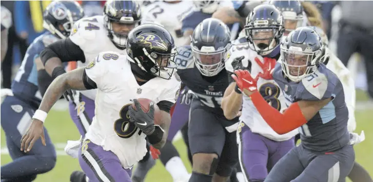  ?? (Photo: AP) ?? Baltimore Ravens quarterbac­k Lamar Jackson (8) scrambles against the Tennessee Titans in the second half of an NFL wildcard play-off football game Sunday, January 10, 2021, in Nashville, Tennessee. The Ravens won 20-13.