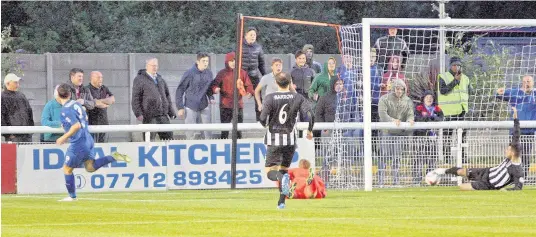  ?? Pic: RICHARD BIRCH ?? Daniel Nardiello (blue) wheels away in celebratio­n after putting Bangor one-up against the Druids