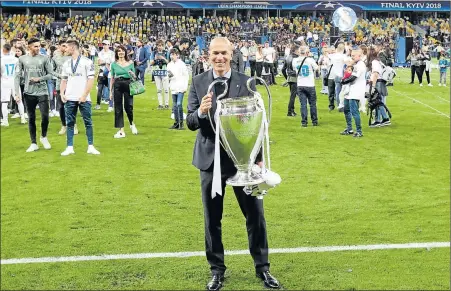  ?? Picture: REUTERS ?? REMARKABLE RECORD: Real Madrid coach Zinedine Zidane poses with the trophy as he celebrates after his team won the Champions League