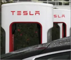  ??  ?? In this May 14, 2015, file photo, Tesla charging stations are shown outside of the Tesla factory in Fremont, Calif. Mozilla, Tesla and other companies are distancing themselves from Facebook following revelation­s of a major leak of user data to...