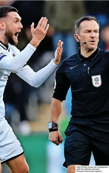  ?? ?? Matt Grimes shows his unhappines­s with the referee’s decision Pictures: Huw Evans Agency
