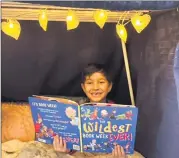  ??  ?? Nate Sutton of Year 1 getting cosy in his reading fort.
