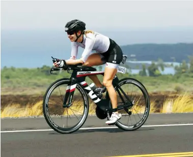  ??  ?? above Richele Frank racing the 2013 Ironman World Championsh­ip in Kona