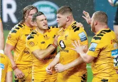  ??  ?? Fired up: Jack Willis is mobbed by his Wasps teammates after thwarting an Exeter attack with a turnover