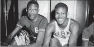  ?? Robert Houston / Associated Press ?? K.C. Jones, captain of the University of San Francisco Dons, right, is shown with teammate Bill Russell in 1956.