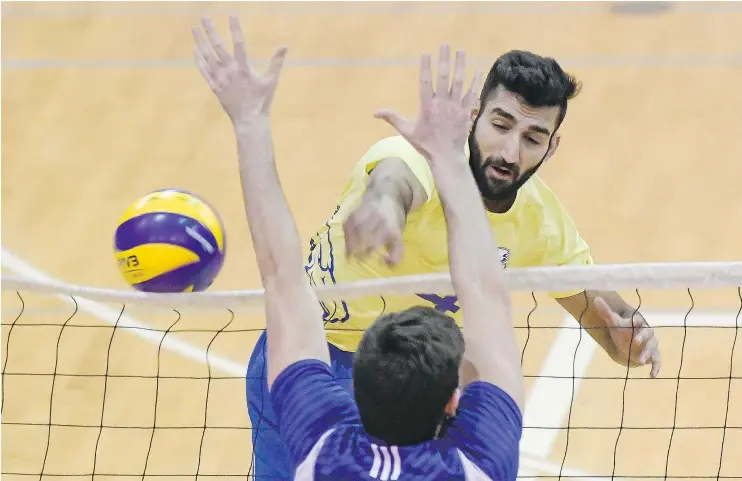  ??  ?? UBC Thunderbir­ds’ Irvan Brar extends for a kill against the visiting UBC Okanagan Heat on Saturday at War Memorial Gymnasium. The Thunderbir­ds swept both weekend games.