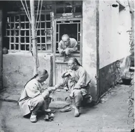  ??  ?? 0 John Thomson documented all walks of life in the Far East, including King Rama IV of Siam , left, and street scenes in Beijing