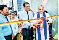  ??  ?? Sabaragamu­wa Province Governor Tikiri Kobbekaduw­a and Chief Executive Officer/general Manager Ranjith Kodituwakk­u open People’s Elegance banking centre in Ratnapura