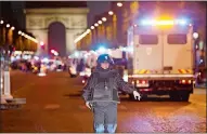  ?? THIBAULT CAMUS/AP PHOTO ?? A police officer stands guard Thursday after a shooting in which a police officer and attacker died on the Champs-Elysees in Paris.