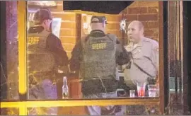  ?? Patrick T. Fallon For The Times ?? A WINDOW at the Borderline Bar and Grill in Thousand Oaks bears a bullet hole. The capacity of the magazine used by the gunman has not been confirmed.