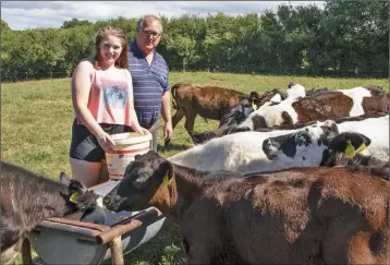 ??  ?? Jer O’Mahony with his daughter Sarah feeding calves at his farm in Ballymitty.