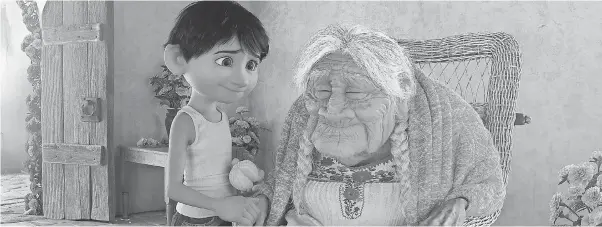  ??  ?? Miguel (voiced by Anthony Gonzalez) shares a special bond with his great-grandmothe­r Mamá Coco (Ana Ofelia Murguía). PIXAR