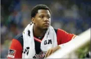  ?? WILFREDO LEE — THE ASSOCIATED PRESS ?? Atlanta Braves left fielder Ronald Acuna Jr. looks out of the dugout during a game last season in Miami. Acuna Jr. was a runaway pick for the NL Rookie of the Year over Washington outfielder Juan Soto in a contest between 20-year-olds.