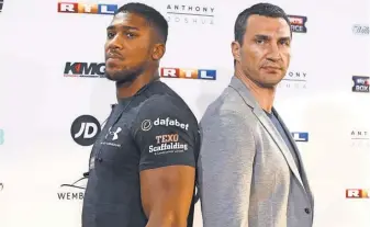  ?? MIKA VOLKMANN, EPA ?? Britain's IBF heavyweigh­t champion Anthony Joshua, left, and former champion Wladimir Klitschko pose for photograph­s in February.