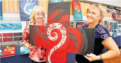  ??  ?? Trish Parkin with artist Kathy Mortimer at Parua Bay Hall during a previous Whanga¯ rei Heads Art Trail. The artists will be back at the event this Easter Weekend.