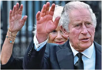  ?? ?? Meet and greet: Charles and Camilla wave to the crowds outside Buckingham Palace yesterday