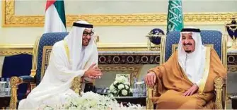  ??  ?? Above: Shaikh Mohammad Bin Zayed meets with King Salman upon arriving in Riyadh to attend the US-GCC summit. Below: Obama is greeted upon his arrival at King Khalid Internatio­nal Airport in Riyadh yesterday.