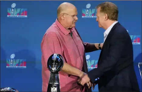  ?? ROSS D. FRANKLIN — THE ASSOCIATED PRESS ?? Kansas City Chiefs head coach Andy Reid, left, is congratula­ted by NFL Commission­er Roger Goodell during a Super Bowl news conference Monday in Phoenix.