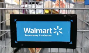  ?? — Reuters ?? Walmart is the largest retailer to hit upon the combinatio­n of retail and health insurance.