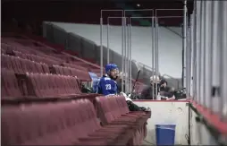  ?? DARRYL DYCK ?? Vancouver Canucks’ Alexander Edler sits in the penalty box, from which the glass has been removed as part of COVID-19 measures, during the second period of the team’s NHL hockey game against the Calgary Flames on Saturday, Feb. 13, 2021.