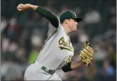  ?? ABBIE PARR — THE ASSOCIATED PRESS ?? Oakland A's starting pitcher Mason Miller delivers to a Minnesota Twins batter during the fifth inning Tuesday.