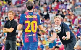  ?? AFP ?? Barcelona coach Ronald Koeman (R) surprised journalist­s at a news conference on Wednesday by reading a prepared statement that called for patience and practicall­y dismissed the team’s chances of achieving any significan­t results this season.