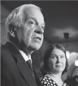  ?? ADRIAN WYLD/THE CANADIAN PRESS ?? Health Minister Jane Philpott listens as John McCallum responds to a question following a meeting of the Ad Hoc Committee on Refugees on Parliament Hill on Friday.