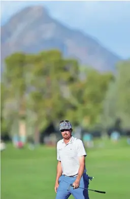  ?? GETTY IMAGES ?? Tim Petrovic looks over the 16th green during the first round of the Charles Schwab Cup Championsh­ip at Phoenix Country Club on Thursday. Petrovic shot a 63 to share the lead with Paul Goydos.