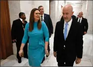  ?? (Arkansas Democrat-Gazette/Stephen Swofford) ?? Gov. Sarah Huckabee Sanders walks to her office alongside Education Secretary Jacob Oliva on Wednesday after outlining her education plan. “There’s some nuances, there’s some technicali­ties that we’re still working through,” Oliva said at the announceme­nt.