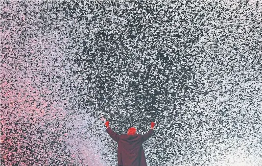  ?? ALFREDO ESTRELLA/AFP/GETTY IMAGES ?? Presidenti­al candidate Andres Manuel Lopez Obrador waves to supporters during the closing rally of his campaign at Azteca stadium in Mexico City on Wednesday.