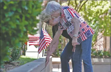  ?? Terrance Armsatrd/News-Times ?? Rememberin­g: Martha Pennington assists Pat Qualls in locating the nameplate commemorat­ing her husband, Don, an Army veteran, at the Union County Courthouse Monday. Pennington and Qualls attended the 2018 Veterans of Foreign Wars Post 2413 annual...