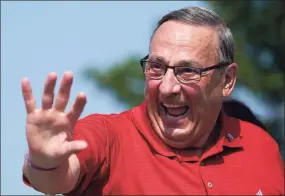  ?? Robert F. Bukaty / Associated Press ?? Former Maine Gov. Paul LePage, a Republican gubernator­ial candidate, waves while marching in the State of Maine Bicentenni­al Parade, on Aug. 21 in Lewiston, Maine.