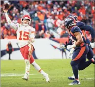  ?? Jamie Schwaberow / Getty Images ?? Patrick Mahomes (15) of the Kansas City Chiefs looks to pass during the second half against the Denver Broncos at Empower Field At Mile High on Saturday in Denver. The Chiefs won 28-24.