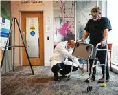  ??  ?? Halawi helps Moreton with his walker earlier this month. “One of the big principles of medicine is do no harm,” Halawi says.