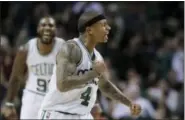  ?? STEVEN SENNE — THE ASSOCIATED PRESS ?? Celtics guard Isaiah Thomas celebrates after scoring during the fourth quarter against the Heat on Sunday.