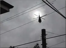  ?? CORNELIUS FROLIK / STAFF ?? A medical helicopter flies near downtown Dayton. Grandview Medical Center says it has no plans for a helipad.