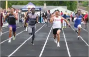  ?? BARRY BOOHER — FOR THE NEWS-HERALD ?? Hawken’s Jordan Harrison nears the finish line to win 4x100durin­g the Division II Austintown-Fitch Regional.