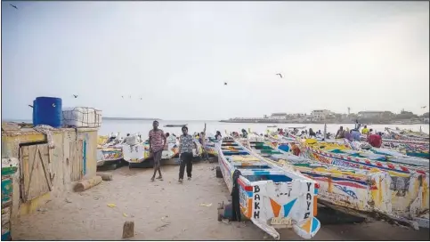  ?? ?? Fishing boats are lined up May 31 at the Soumbediou­ne fish market in Dakar.