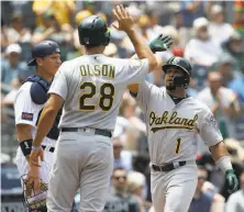  ?? Alex Gallardo / Associated Press ?? A’s second baseman Franklin Barreto celebrates with Matt Olson after hitting a three-run homer in the second inning.