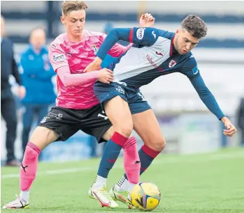  ?? ?? Raith’s Roddy Macgregor tussles with Thistle’s Dario Zanatta for possession