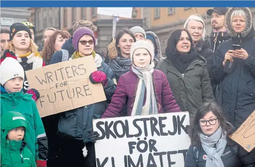  ?? ELISABETH UBBE PHOTOS THE NEW YORK TIMES ?? Like a modern-day Cassandra for the age of climate change, Greta Thunberg’s solitary act of civil disobedien­ce has turned her into a mascot for climate action.