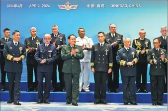  ?? NG HAN GUAN / AP ?? Zhang Youxia (front row, third from left), vice-chairman of the Central Military Commission, poses for a group photo on Monday with the attendees of the 19th Western Pacific Naval Symposium in Qingdao, Shandong province.