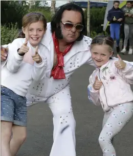  ??  ?? Lilian and Sophie Kavanagh learning some moves from Newtown Elvis.
