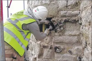  ??  ?? Repair work to the historic Westgate Towers and right; Steve Allen and James Caldon