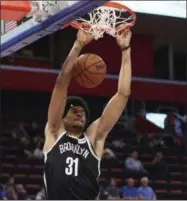  ?? CARLOS OSORIO - THE ASSOCIATED PRESS ?? Brooklyn Nets center Jarrett Allen dunks during the first half of an NBA preseason basketball game against the Detroit Pistons, Monday, Oct. 8, 2018, in Detroit.