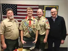  ?? Courtesy photos ?? Second from left, Alexander Walker Boron receive his Eagle Scout rank.