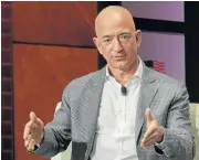  ?? /Reuters ?? Sale: Amazon CE Jeff Bezos crossed the threshold just as Amazon prepares to kick off its 36-hour summer sales event.