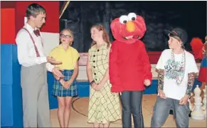  ??  ?? STRANGE MIX: School principal (Coper Hughes) talks animatedly to school nerd (Tamara Ward) and school teacher (Hannah Mclean) while Elmo (Kaela Leitch) and the school ‘‘homie‘‘ (Connor Bernhard) keep it cool.